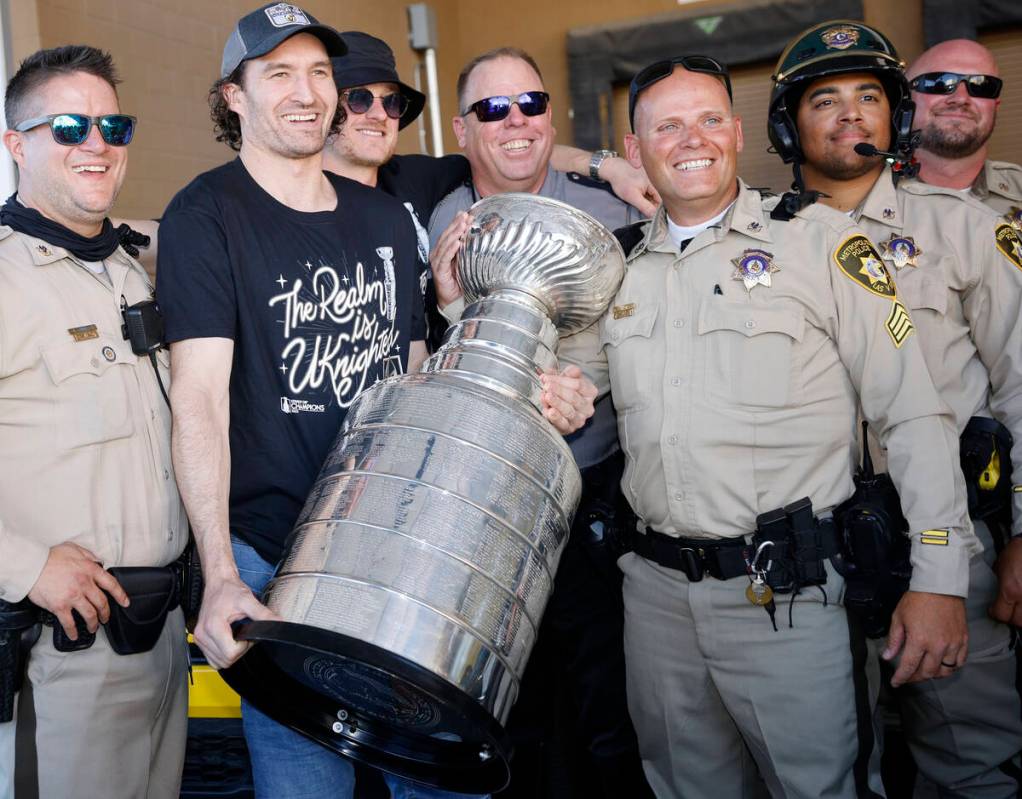 Golden Knights right wing Mark Stone poses for a photo with Las Vegas police officers before th ...