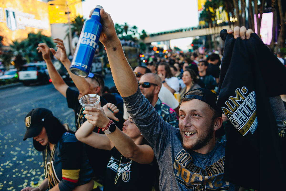 Golden Knights fans cheer as the Stanley Cup championship parade makes its way down the Strip o ...