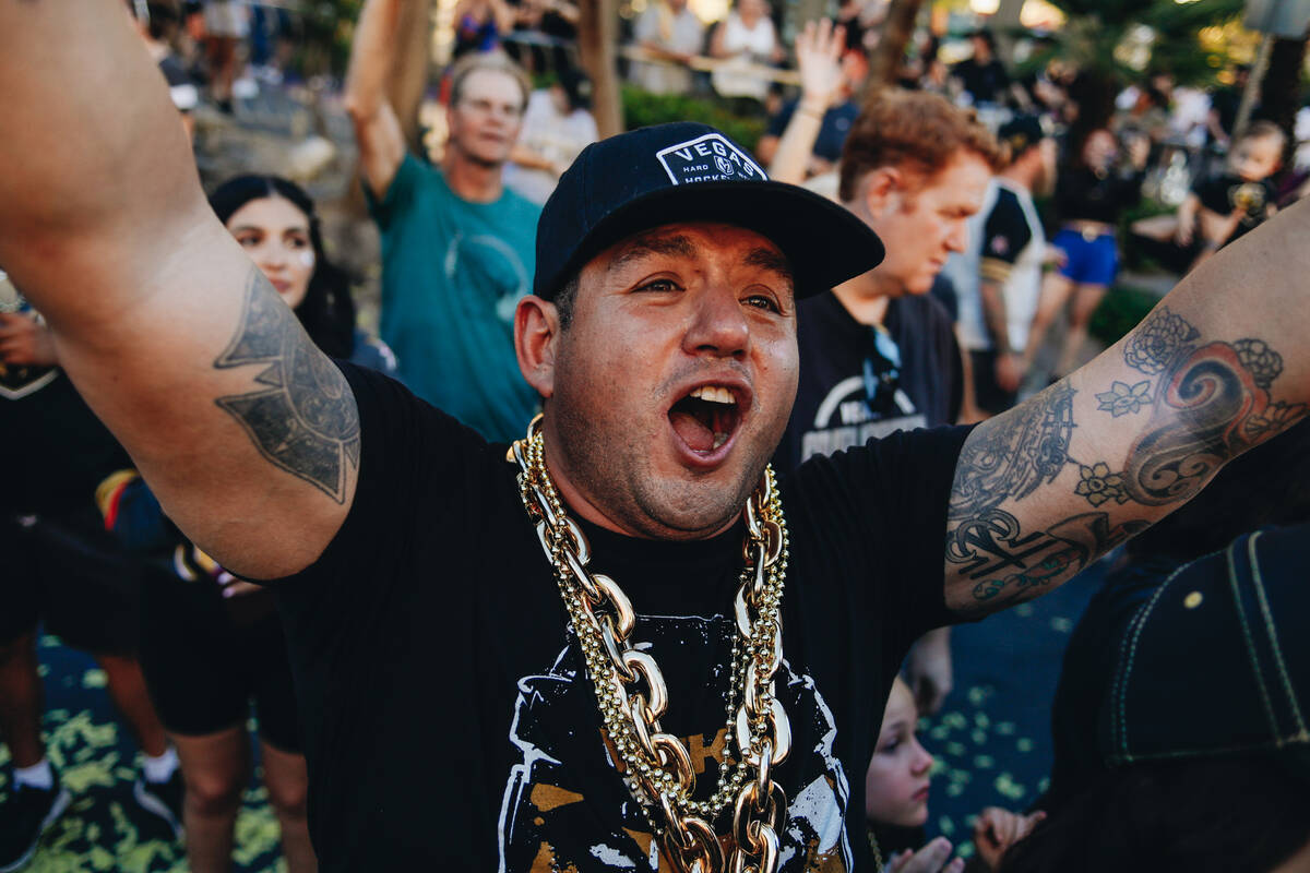 A Golden Knights fan cheers as the Stanley Cup championship parade makes its way down the Strip ...