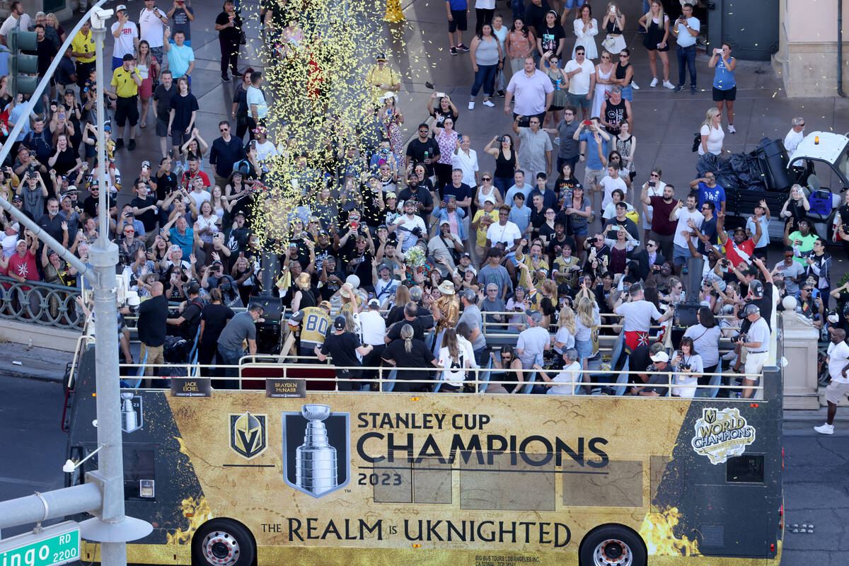 Fans cheer the Golden Knights’ Stanley Cup championship parade on the Strip at Flamingo ...