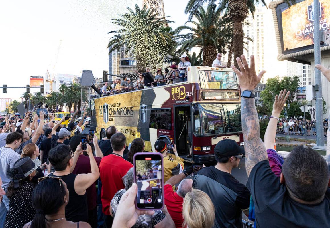 Golden Knights fans and players celebrate during a parade to mark their team's Stanley Cup win, ...