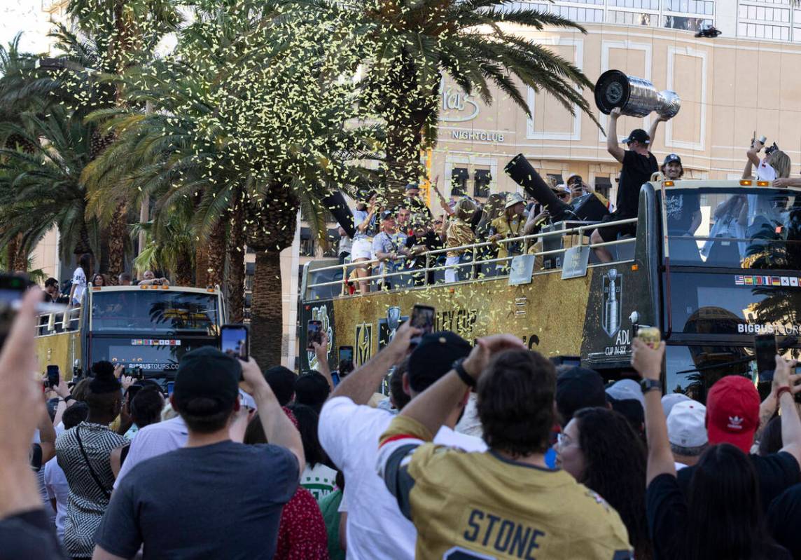 Golden Knights fans and players celebrate during a parade to mark their team's Stanley Cup win, ...