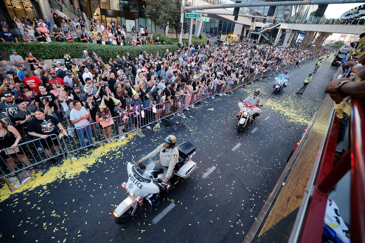 Las Vegas police officers ride motorbikes as fans cheer during the Golden Knights’ NHL h ...