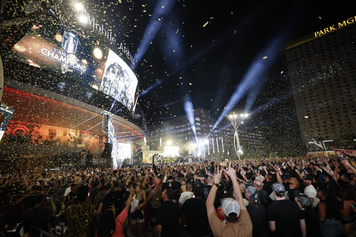 People celebrate during a rally at Toshiba Plaza after the Golden Knights’ NHL hockey St ...