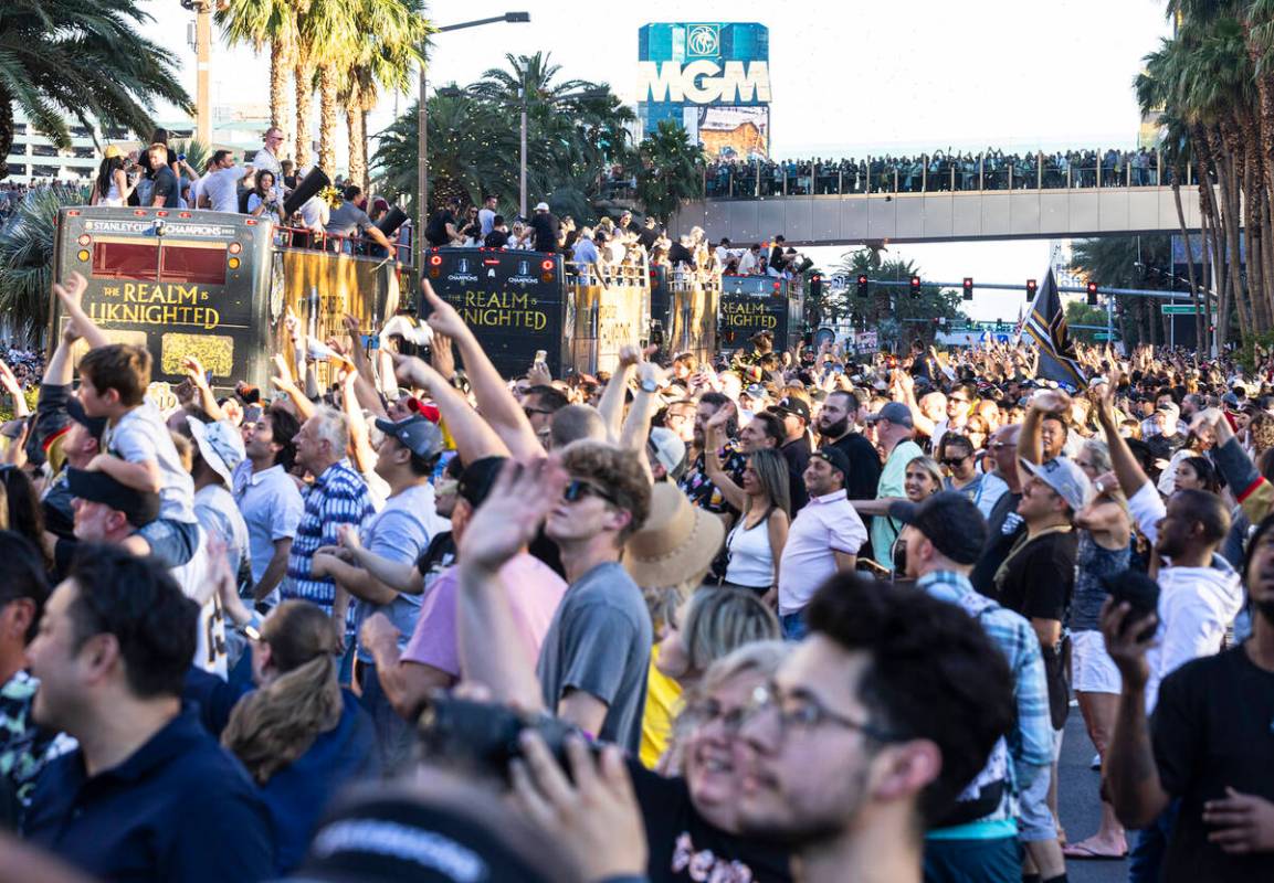 Golden Knights fans and players celebrate during a parade to mark their team's Stanley Cup win, ...