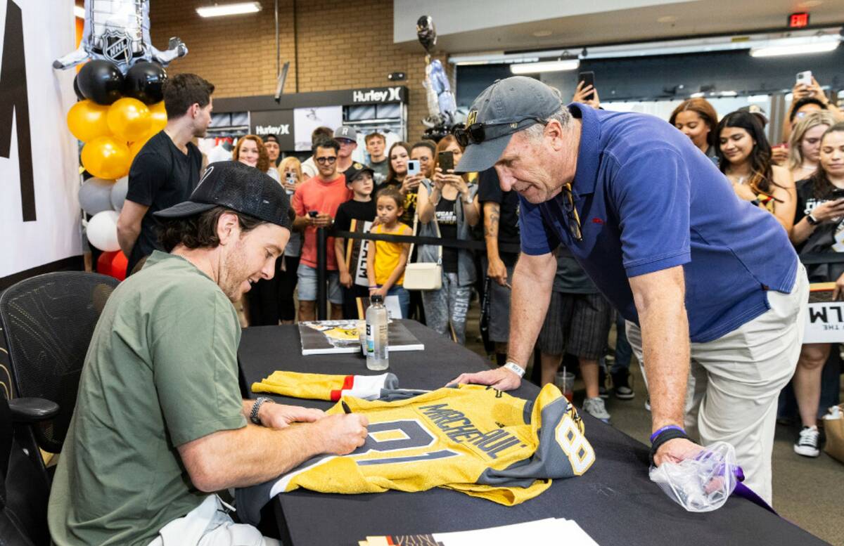 Jonathan Marchessault signs an autograph to Rick Williams at Dick's Sporting Goods, on Monday, ...