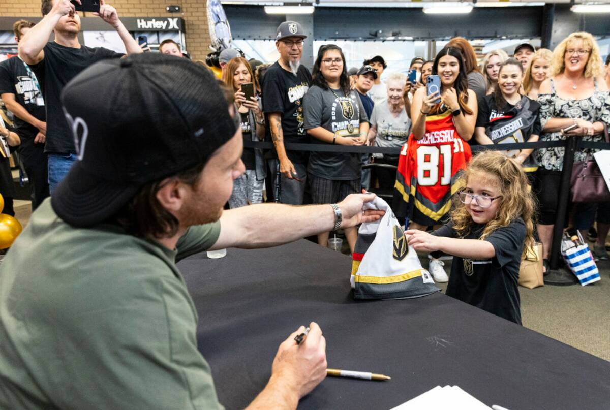 Parker Ashbaugh's, 4, receives her signed Golden Knights jersey from Jonathan Marchessault at D ...