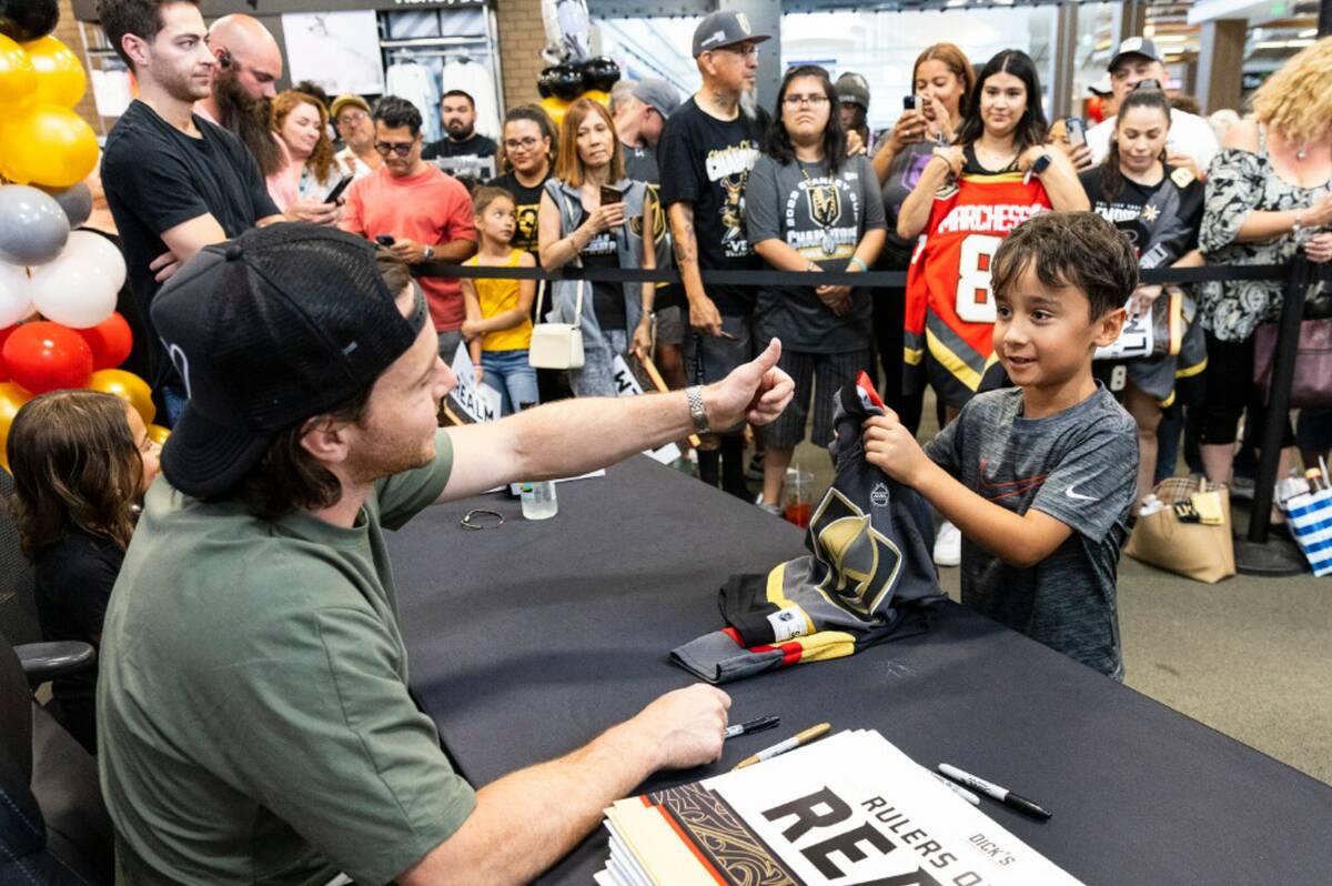 Jonathan Marchessault flashes a thumbs-up after signing an autograph to Bobby Sandhu, 7, at Dic ...