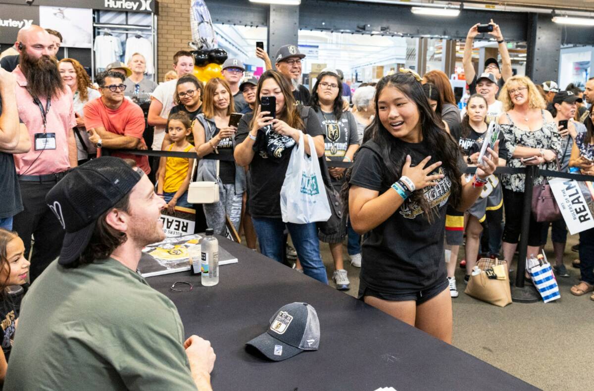 Madison Morada reacts after Jonathan Marchessault signed her merchandise at Dick's Sporting Goo ...