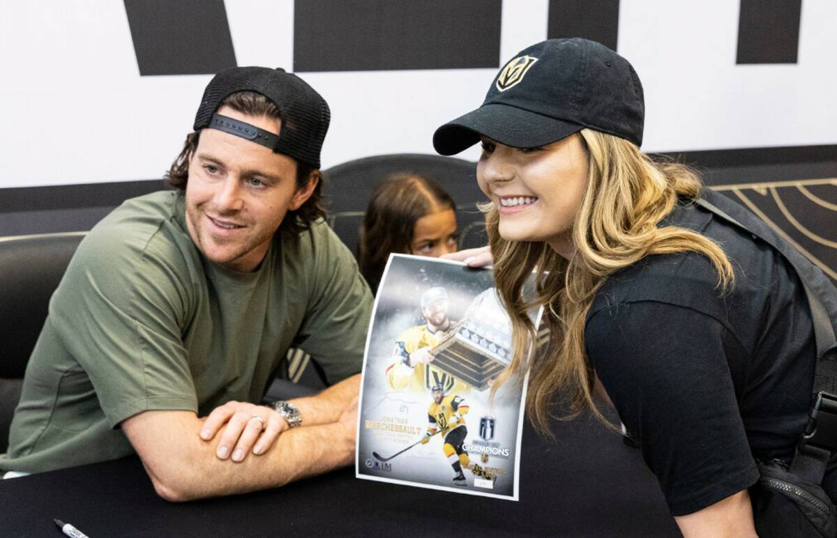 Jonathan Marchessault poses for a photo after signing an autograph to Carlie Cass at Dick's Spo ...