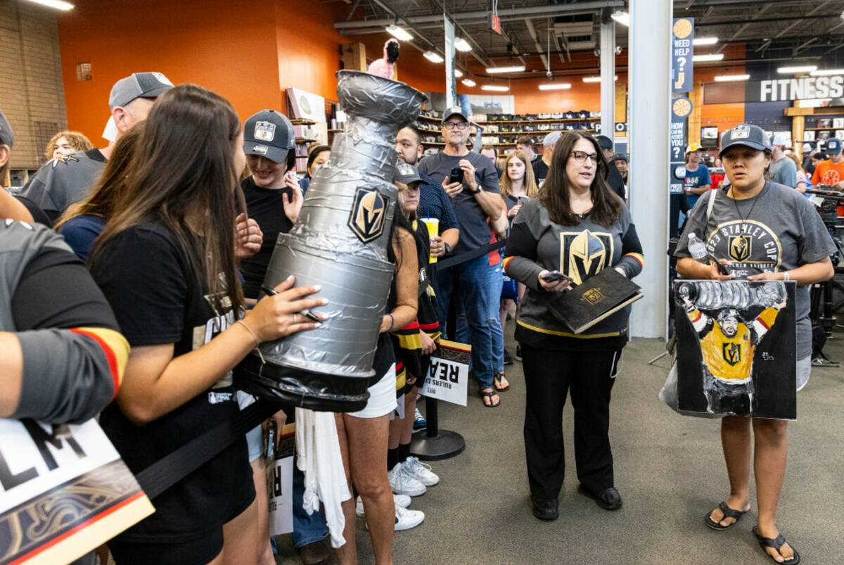 Golden Knights fans wait in line to get their merchandise signed by Jonathan Marchessault at Di ...