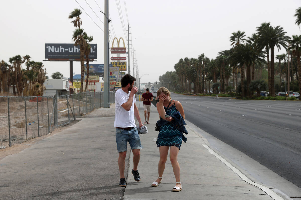 Michael Erlenkötter and Marie Kröger of Germany brace during a gust of high wind and ...