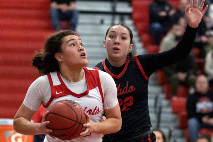 Liberty’s Alia Matavao, left, shoots against Coronado’s Ashtyn Wick (22) during a Class 5A ...