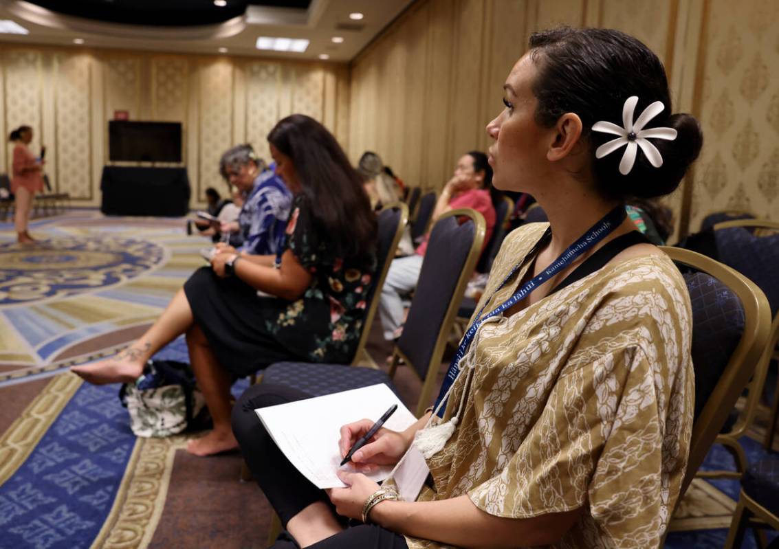 Nalani Kaho’onei of Gilbert, Ariz. takes notes during a hula workshop on Day 1 of the We ...