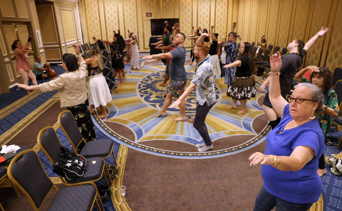 Nancy King of Oahu, Hawaii, right, takes part in a hula workshop on Day 1 of the Western Region ...