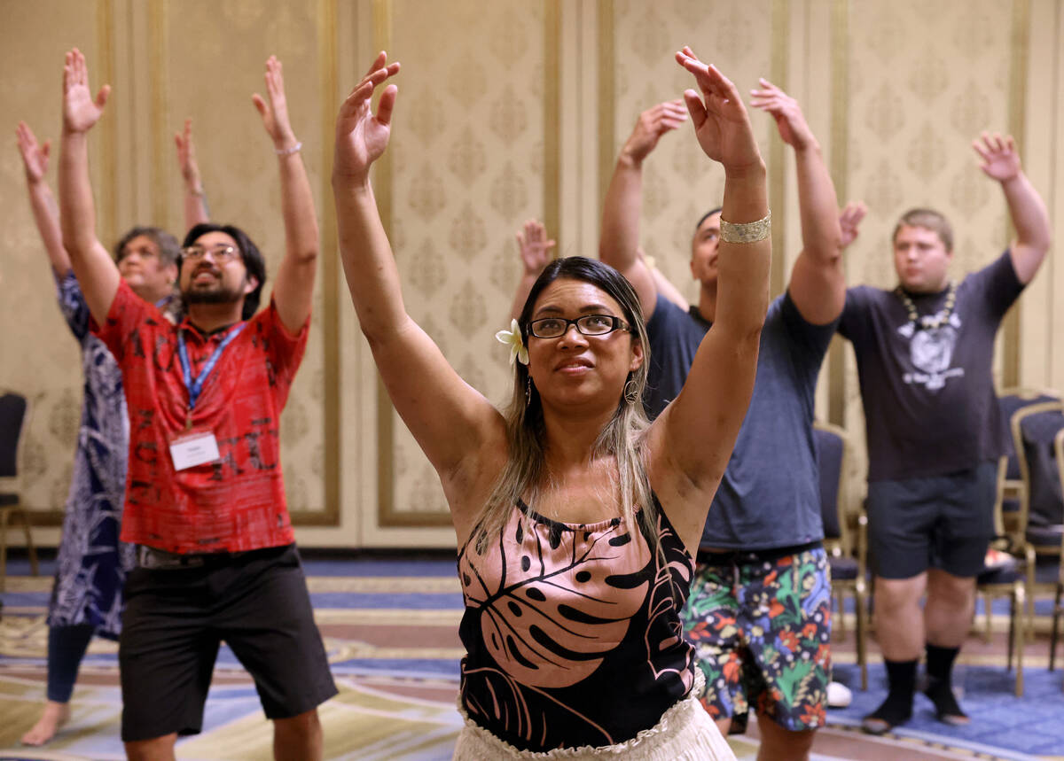 Cece Cullen of Kahalu’u, Hawaii, front, takes part in a hula workshop on Day 1 of the We ...