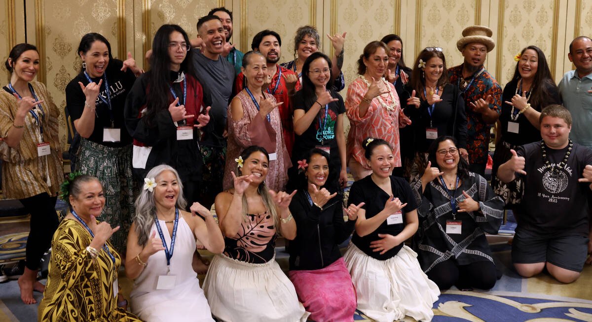 Participants in a hula workshop pose while doing the shaka sign on Day 1 of the Western Regiona ...