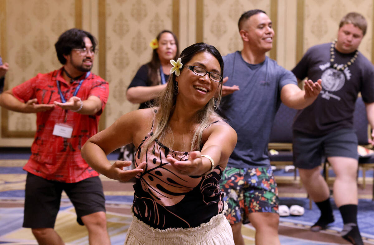 Cece Cullen of Kahalu’u, Hawaii, front, takes part in a hula workshop on Day 1 of the We ...