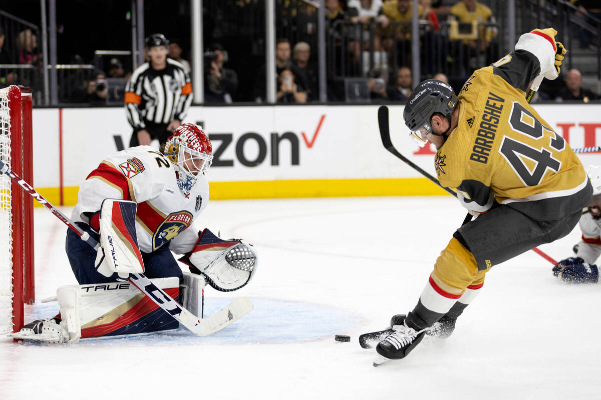 Golden Knights center Ivan Barbashev (49) attempts to score on Florida Panthers goaltender Serg ...