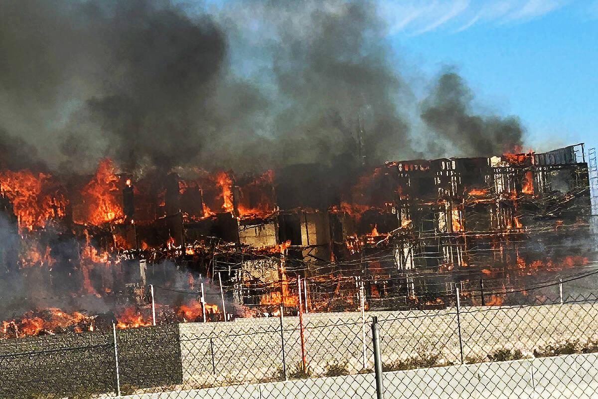 An under-construction residential complex burns near Buffalo Drive and the 215 Beltway on Tuesd ...