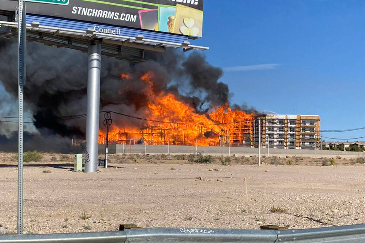 An under-construction residential complex burns near Buffalo Drive and the 215 Beltway on Tuesd ...