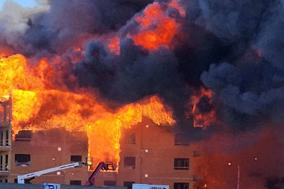 An under-construction residential complex burns near Buffalo Drive and the 215 Beltway on Tuesd ...