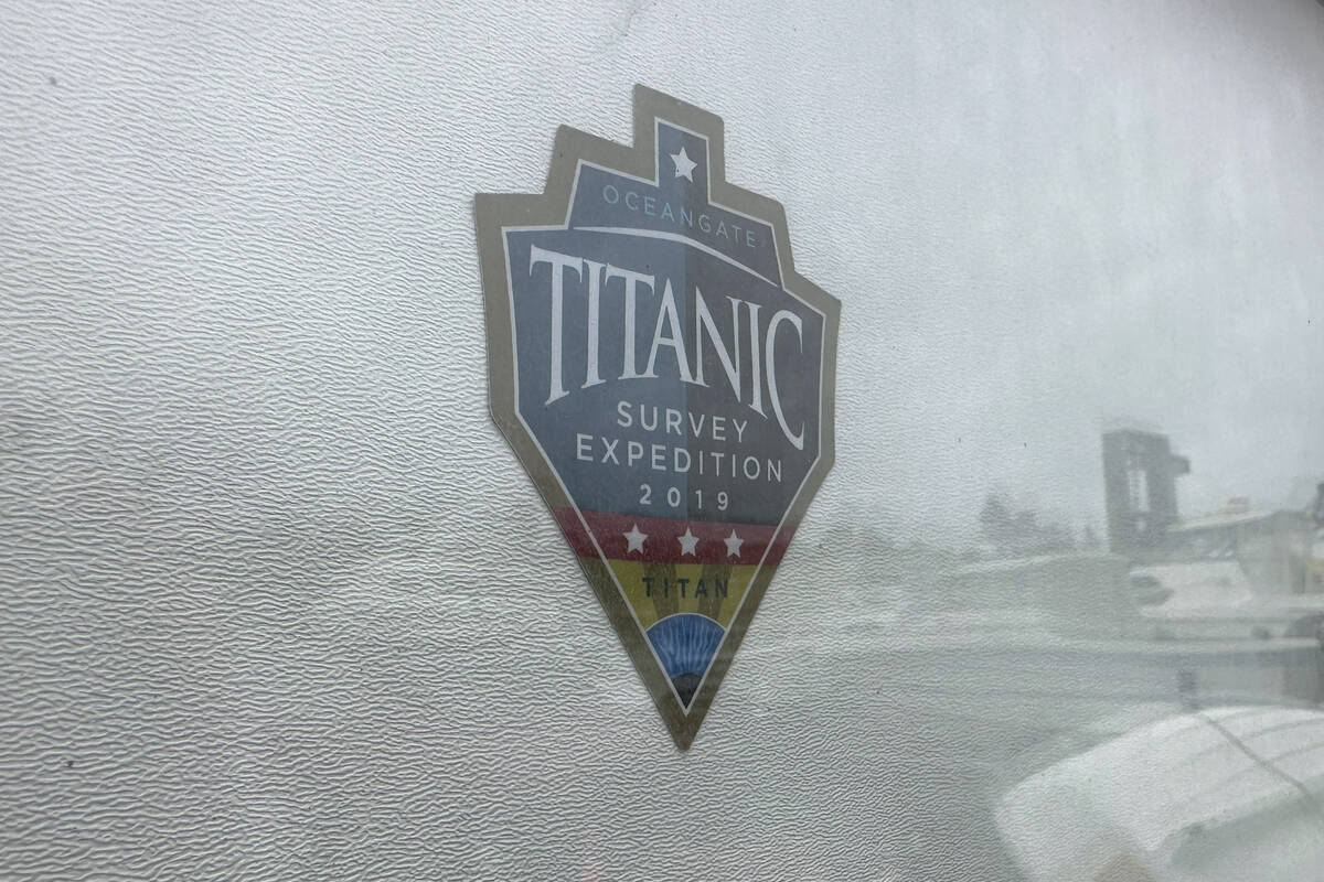 The logo for an OceanGate Expeditions 2019 Titanic expedition is seen on a marine industrial wa ...