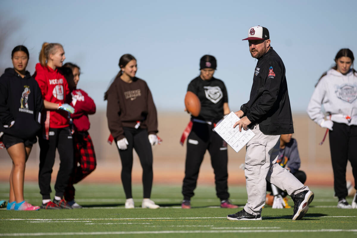 Desert Oasis flag football head coach Todd Thomson walks the field during a flag football pract ...