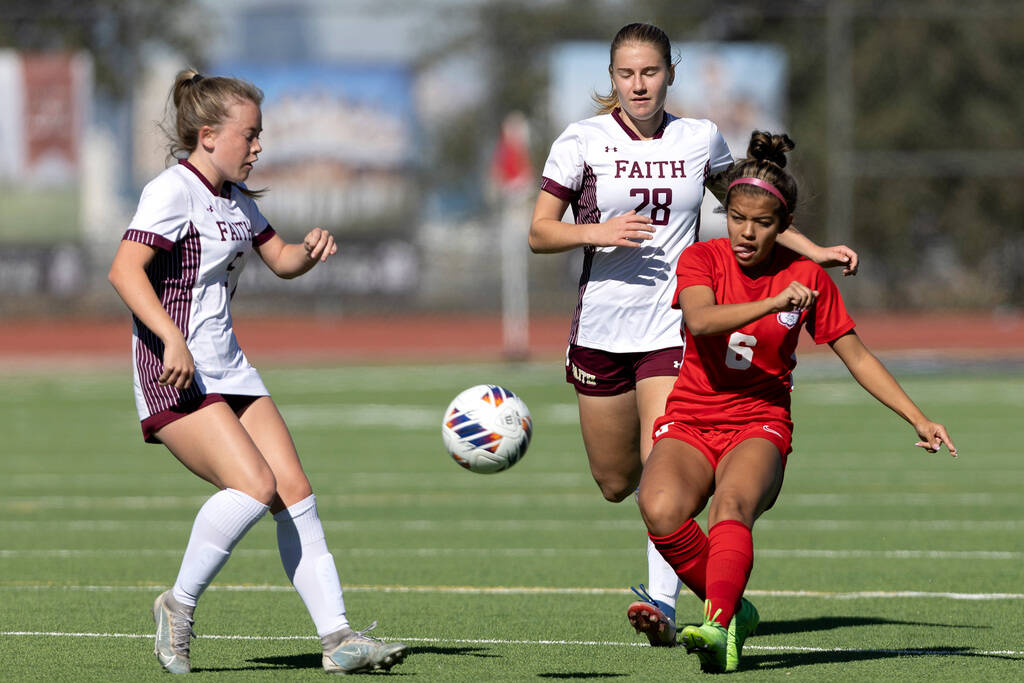 Coronado’s Milan Cordone (6) passes up the field while Faith Lutheran’s McKenna B ...