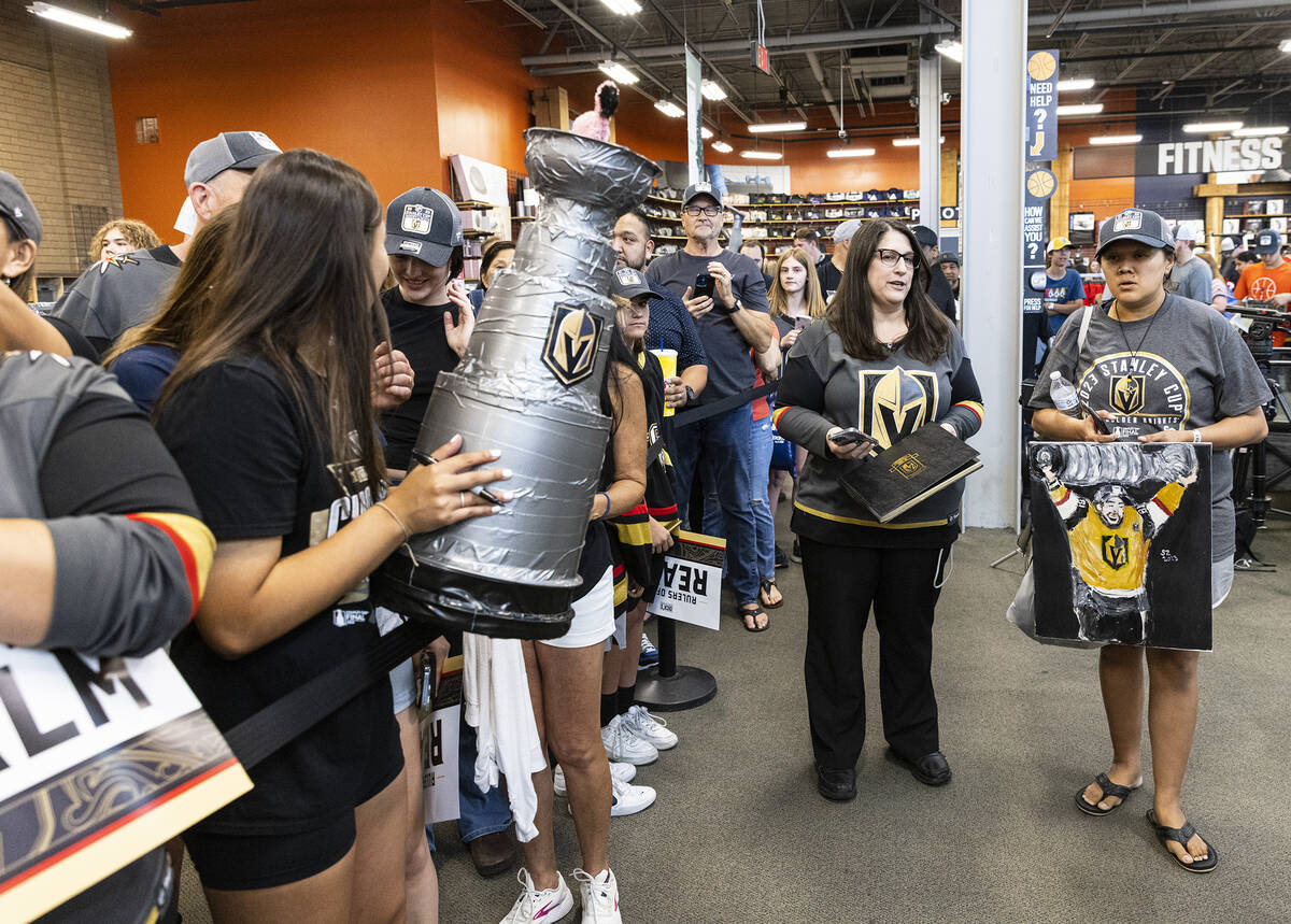 Golden Knights fans wait in line to get their Stanley Cup merchandise signed by Golden Knoights ...