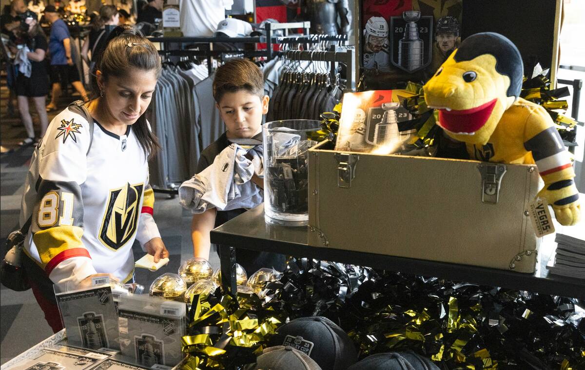 Christina F. and her son Daniel, 9, shop Stanley Cup championship merchandise at The Arsenal at ...