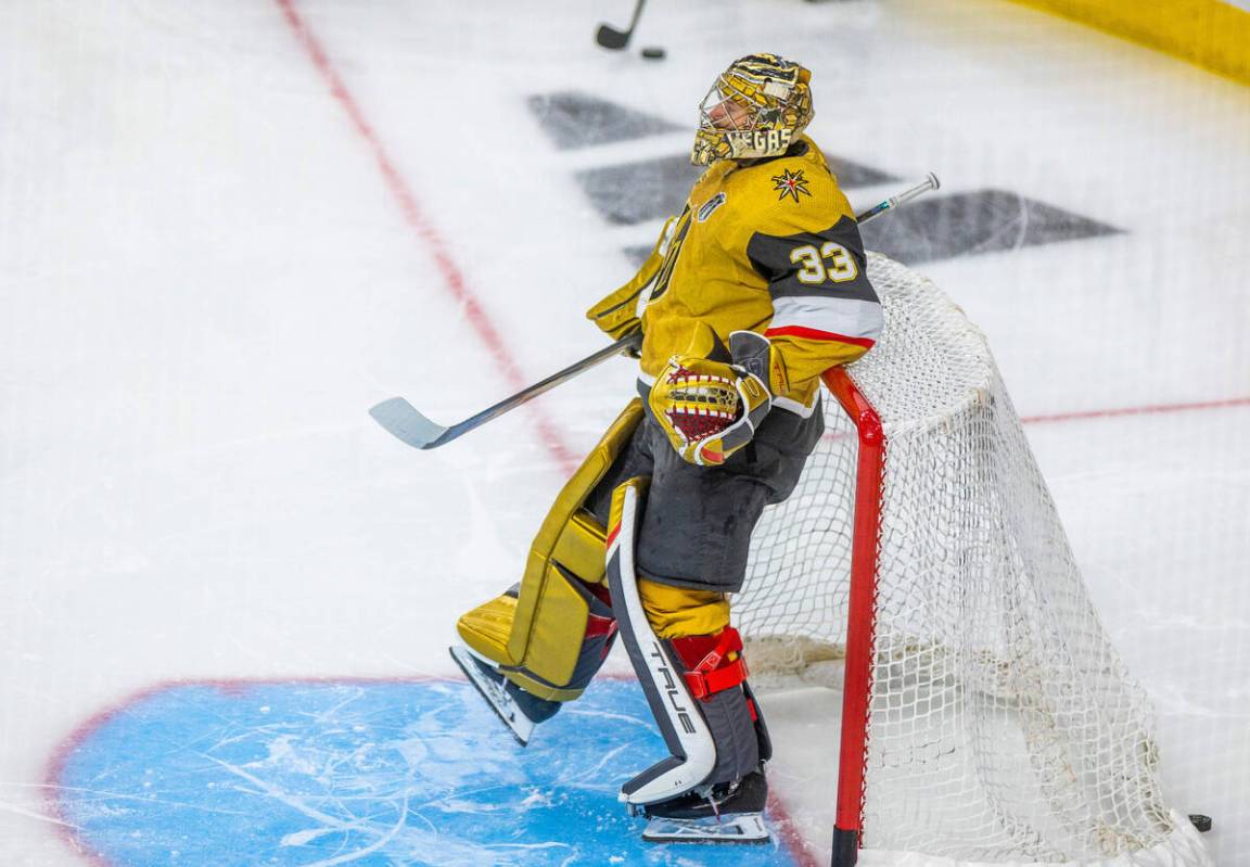 Golden Knights goaltender Adin Hill (33) kicks back on the goal during warmups before Game 5 of ...