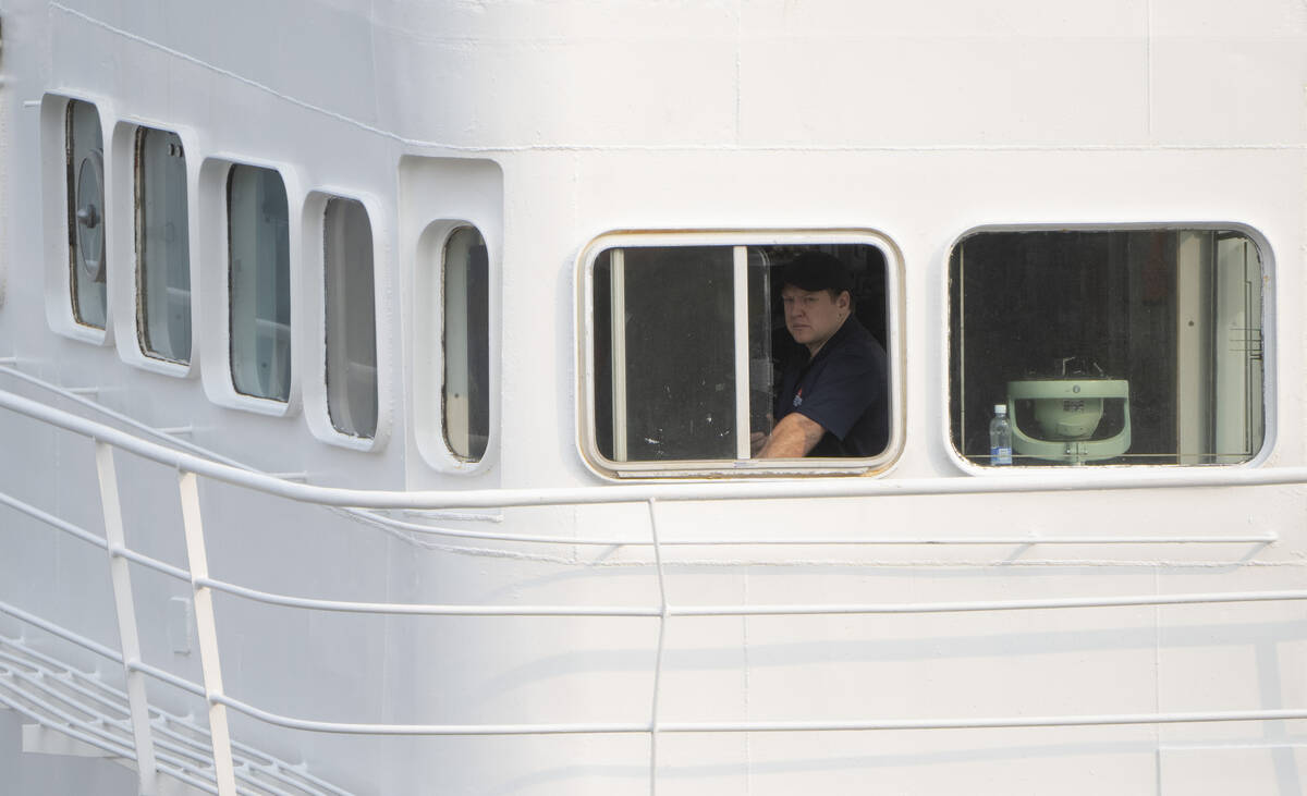 Crew on the bridge of the Polar Prince prepare to dock the ship as it arrives at the Coast Guar ...