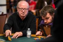 Billy Baxter throws chips into the pot during Day 1A of the $10,000 buy-in Main Event at the Wo ...