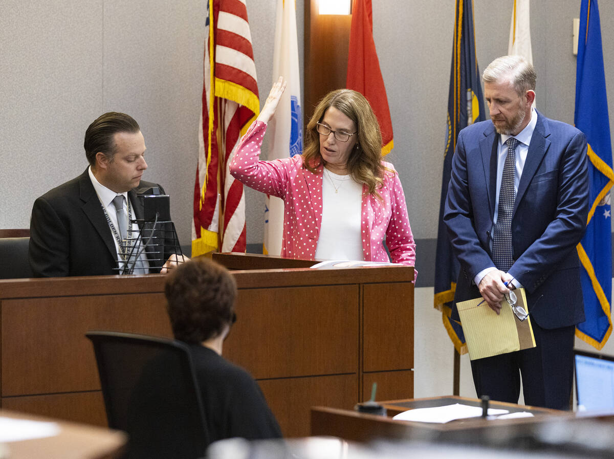 Pamela Weckerly, chief deputy district attorney, center, cross examines James Milligan, left, a ...