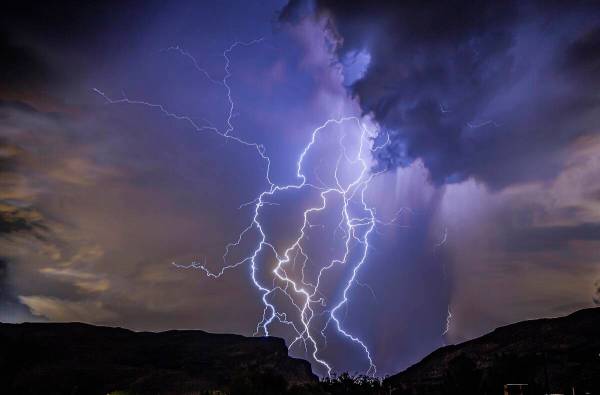 a thunderstorm is seen from Highway 159 over Las Vegas on Thursday, Aug. 11, 2022. (Dakota Snid ...