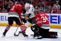 Vegas Golden Knights center William Karlsson (71) battles for the puck against Chicago Blackhaw ...