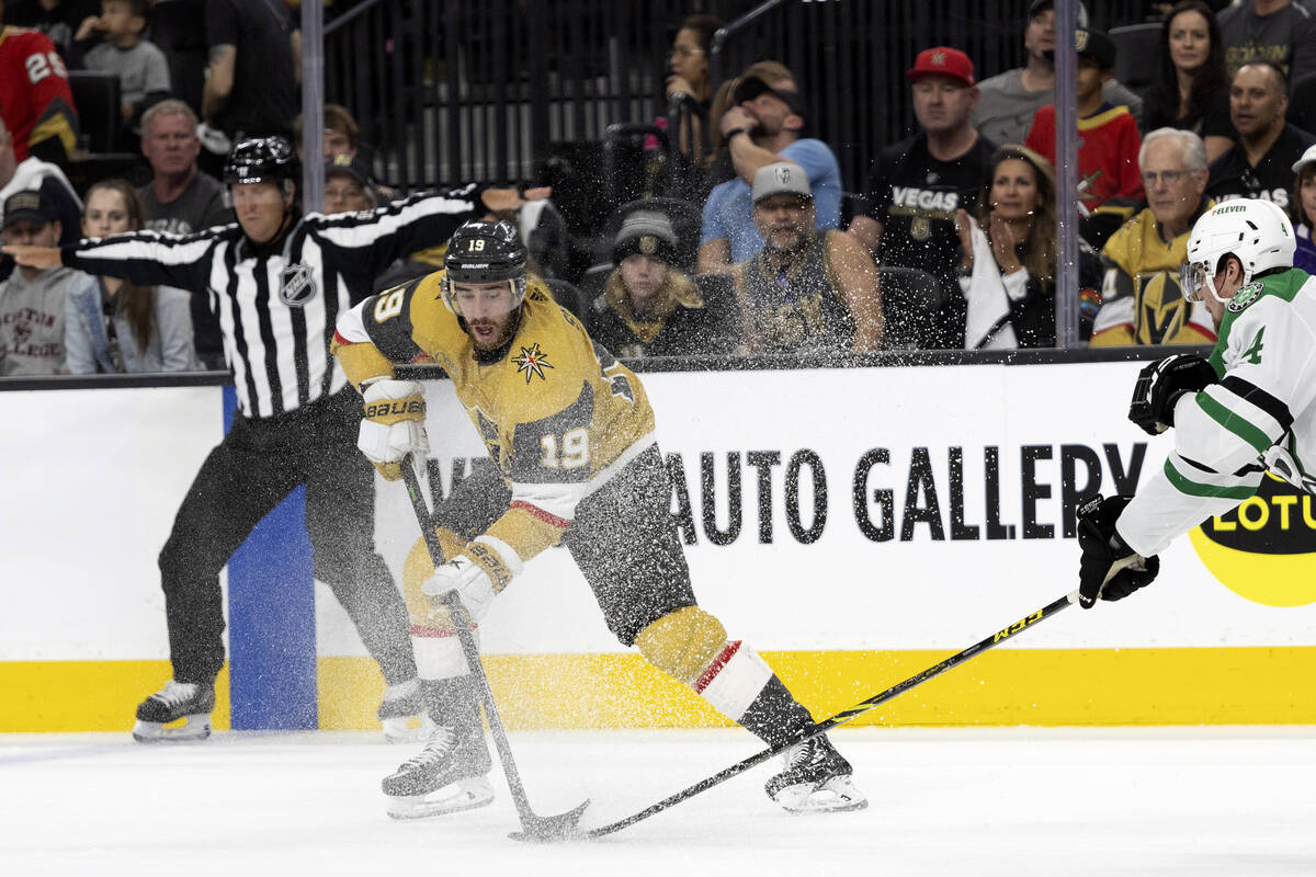 Golden Knights right wing Reilly Smith (19) battles for the puck with Dallas Stars defenseman M ...