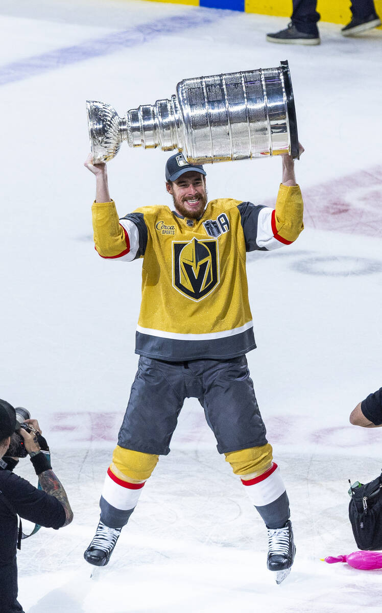 Golden Knights right wing Reilly Smith (19) hoists the Stanley Cup after defeating the Florida ...