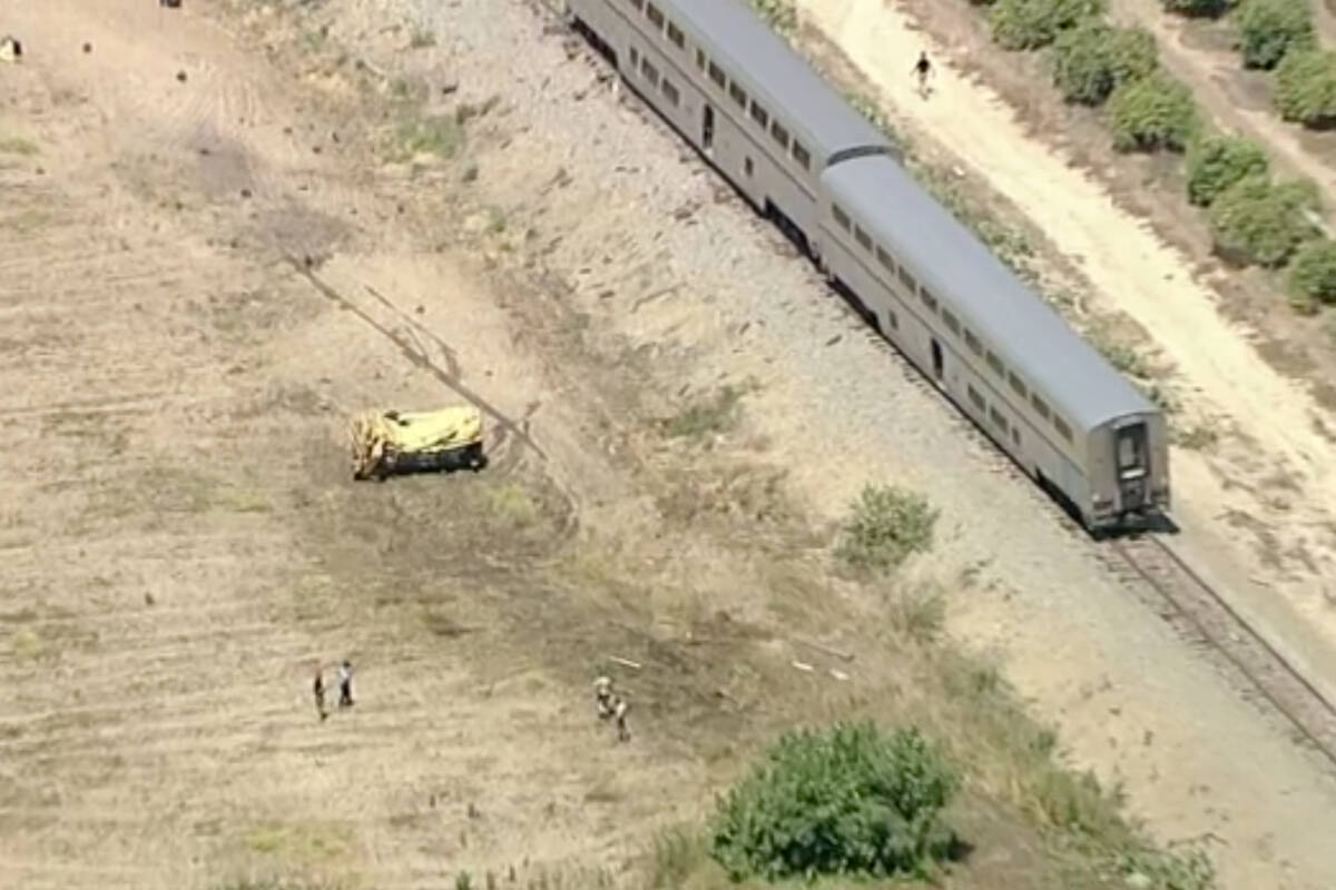 Emergency personnel respond to the scene after an Amtrak passenger train derailed after strikin ...