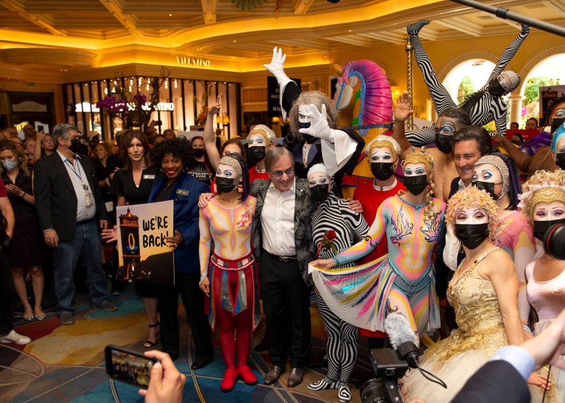 Cast members of "O" and Cirque du Soleil CEO Daniel Lamarre, center, pose for photos at Bellagi ...