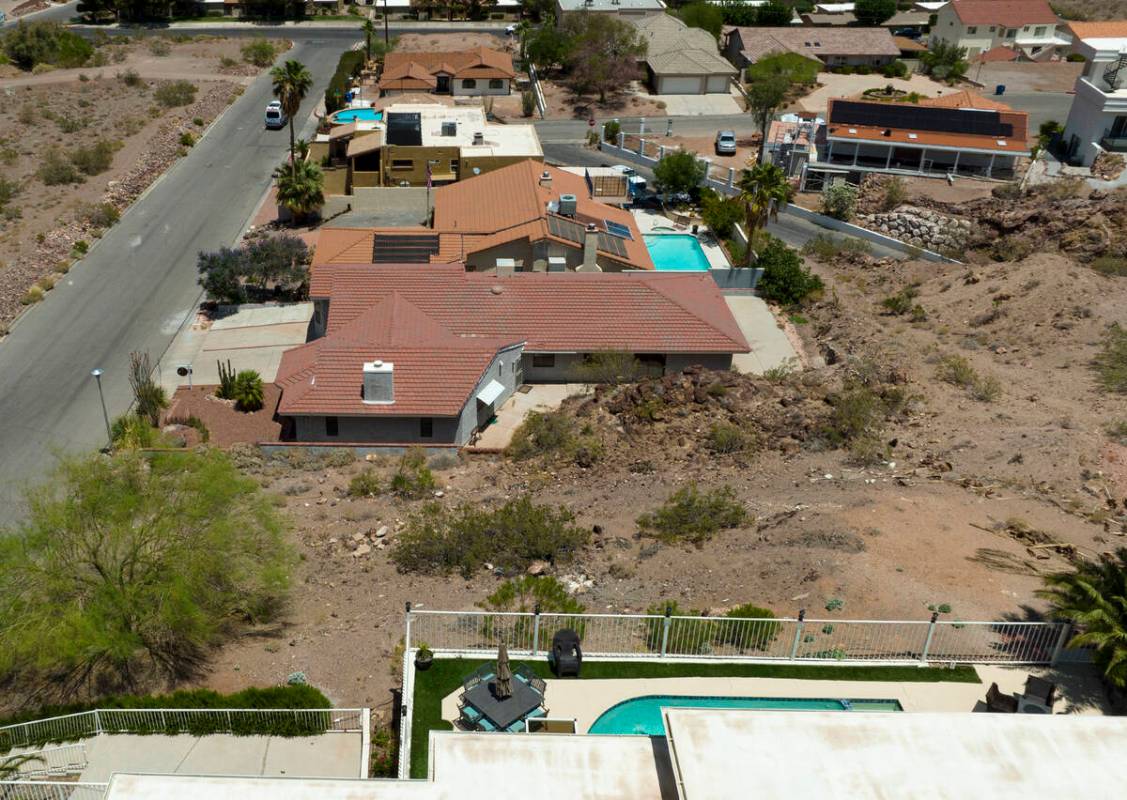 A vacant homesite, center, is seen at the corner of Judi Place and Isabel Drive, on June 2, 202 ...