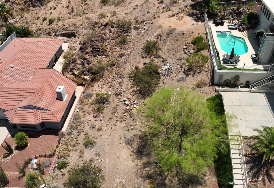 A vacant homesite, center, is seen at the corner of Judi Place and Isabel Drive, on June 2, 20 ...