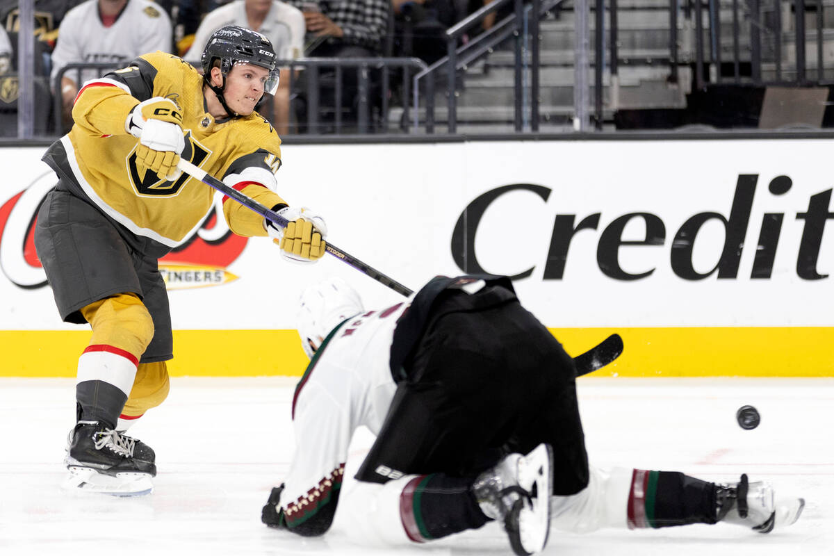 Golden Knights left wing Pavel Dorofeyev (16) shoots against Coyotes defenseman Patrik Nemeth ( ...