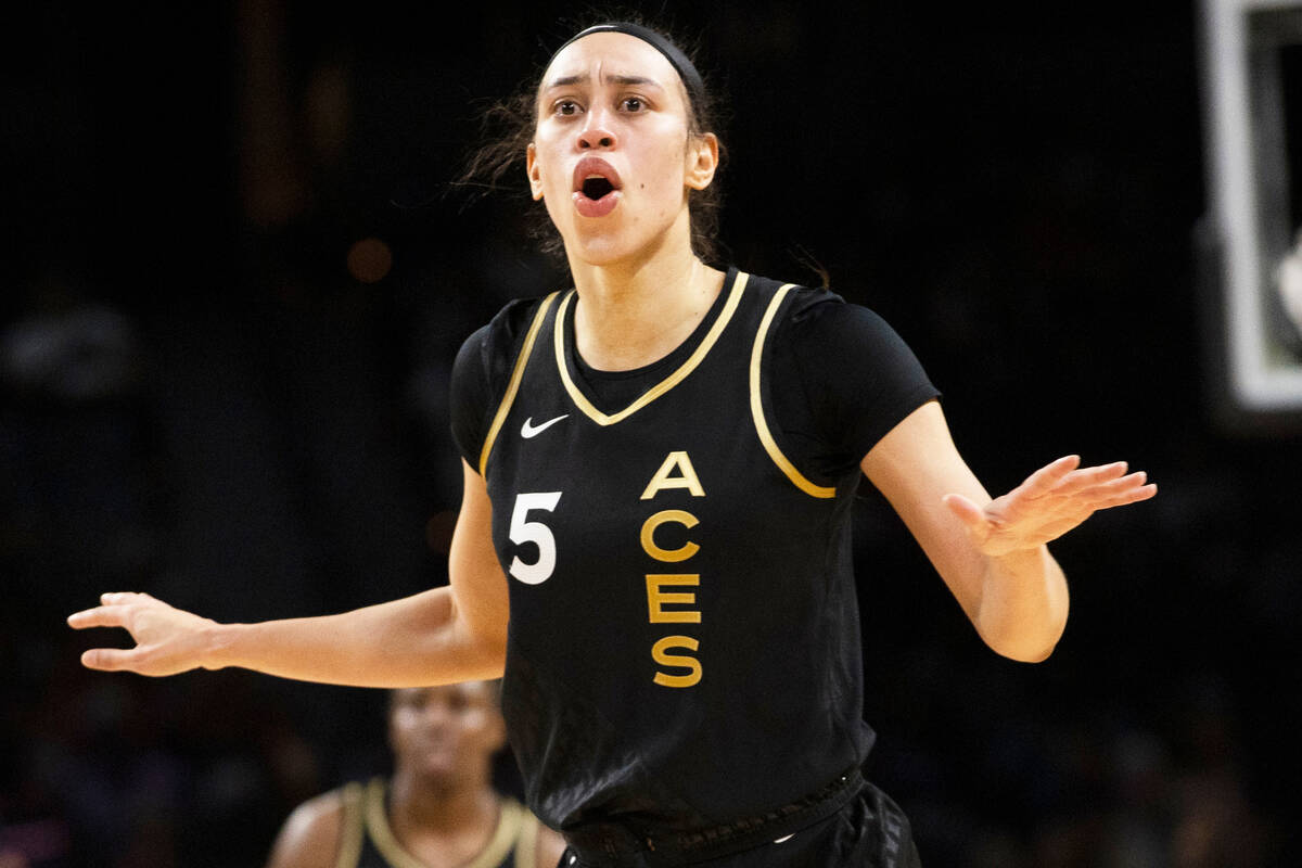 Aces forward Dearica Hamby (5) argues a call in the first half of a WNBA basketball game agains ...