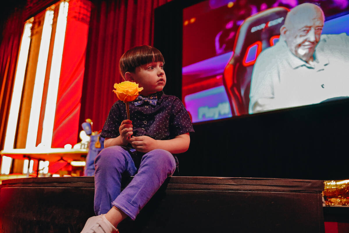 Johnny Brunson, 4, the grandson of poker legend Doyle Brunson, sits on the steps to the Jubilee ...