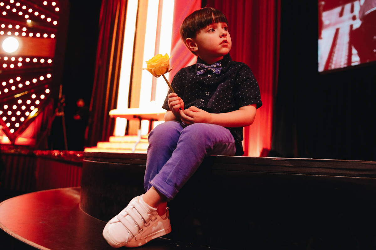 Johnny Brunson, 4, the grandson of poker legend Doyle Brunson, sits on the steps to the Jubilee ...