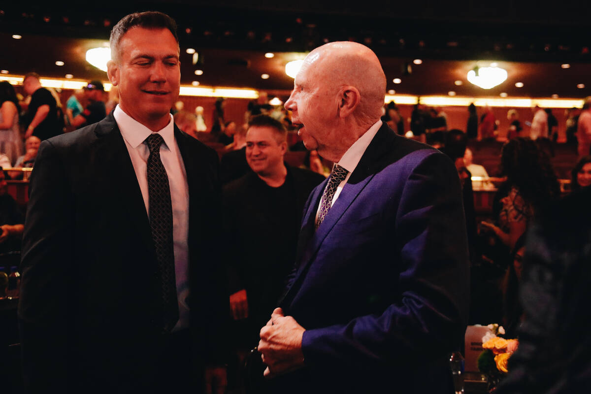 Businessman Jack Binion, right, speaks to Brian Balsbaugh, Doyle Brunson’s agent, follow ...