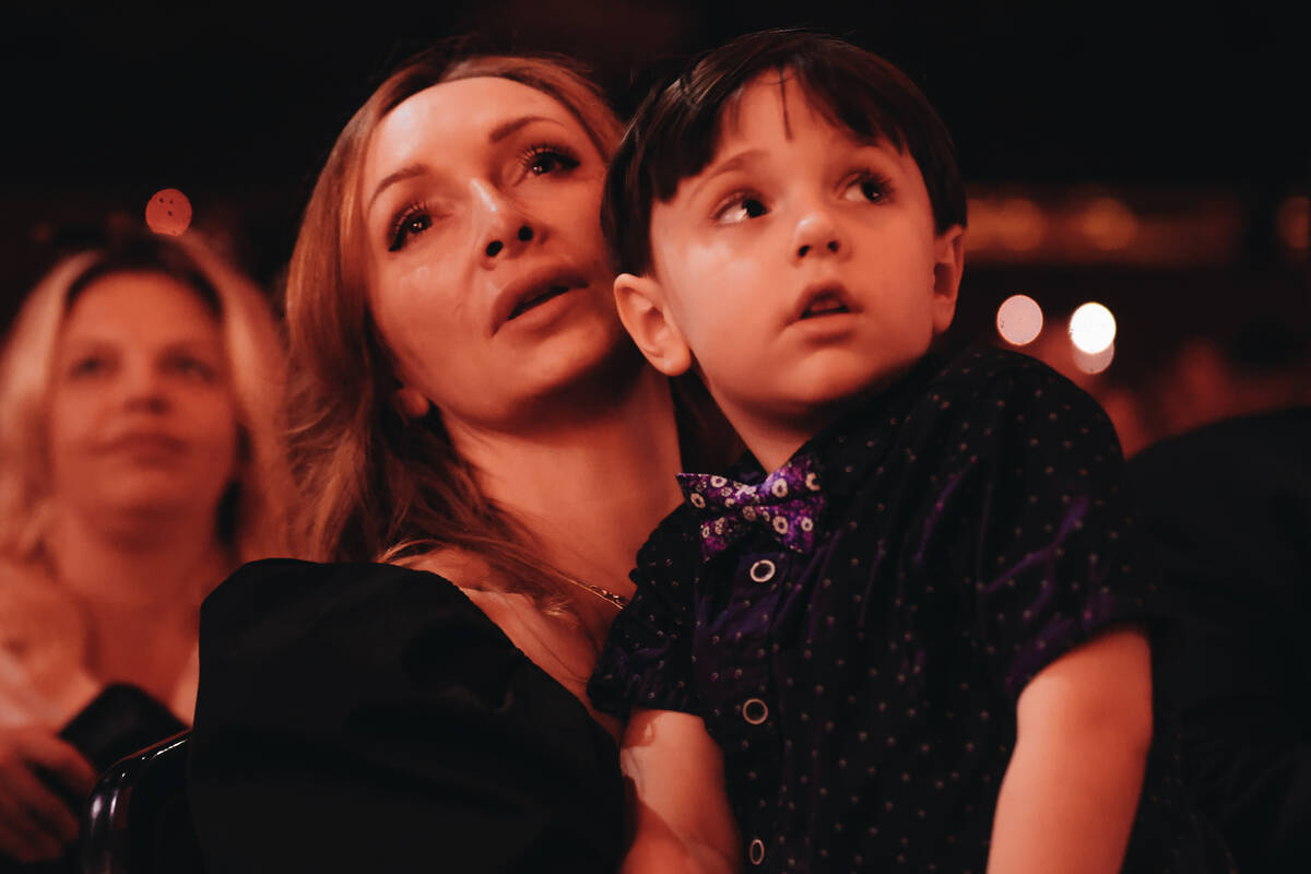 Anjela Brunson, left, holds her son, Johnny Brunson, 4, during a celebration of life ceremony f ...