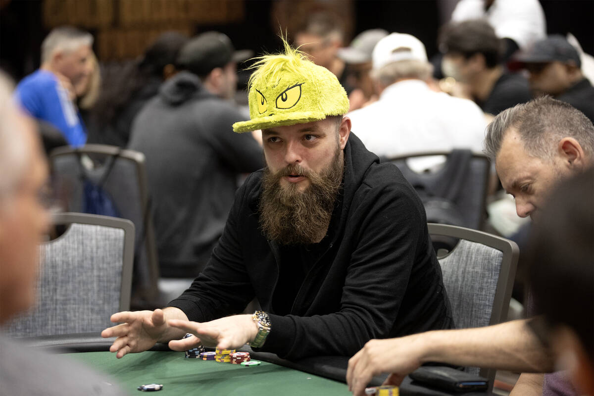 A player wears a Grinch hat during the World Series of Poker $10,000 buy-in No-limit Hold&#x201 ...